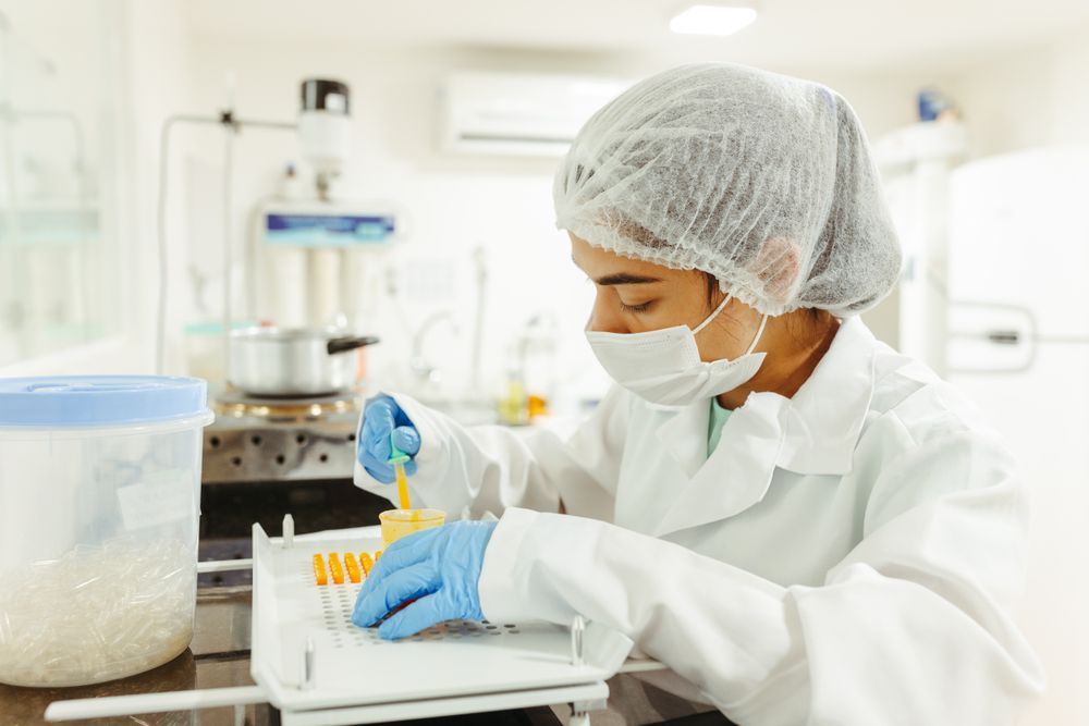 Laboratory technician in PPE preparing samples for meth contamination testing in Oklahoma