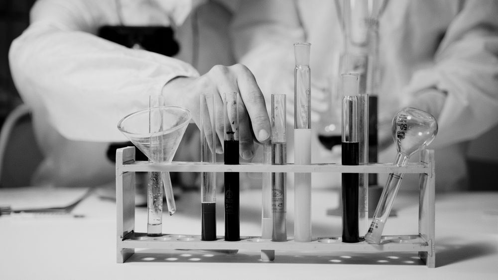 Laboratory test tubes being analyzed during post-remediation clearance testing in Oklahoma