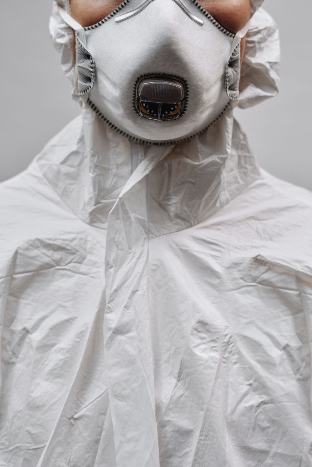 Close-up of a biohazard cleanup technician wearing a respirator and protective suit in Skiatook, Oklahoma